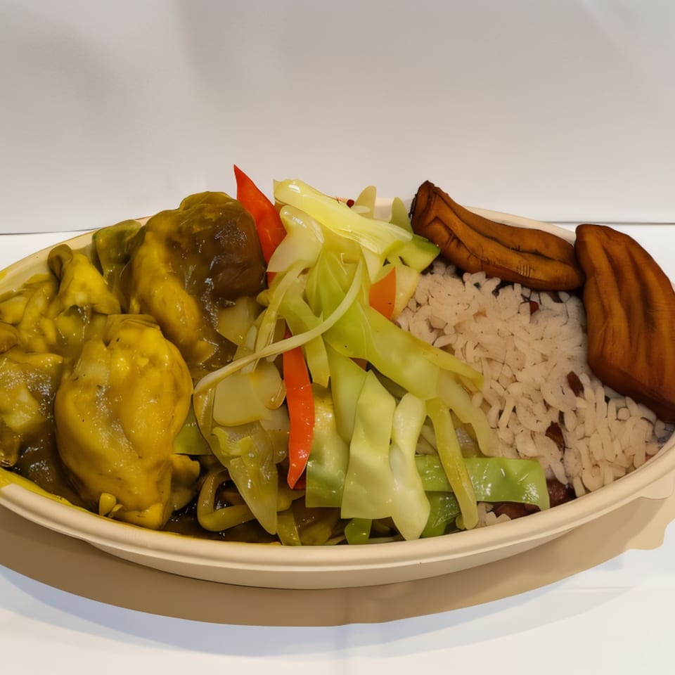 Jahmakin Jerk n Juice curry chicken, cabbage, rice and peas, and plantains in a bowl.